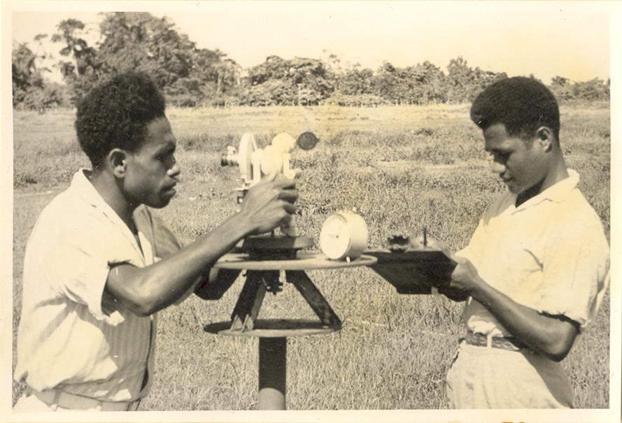 BD/8/1 - 
Two Papuan men operating meteorological equipment
