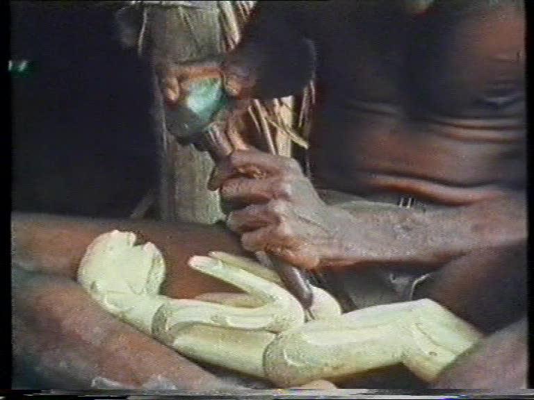 FI/1200/55 - 
Matjemosh: A woodcarver from the village of Amanamka, Asmat tribe, on the Southern West coast of New Guinea
