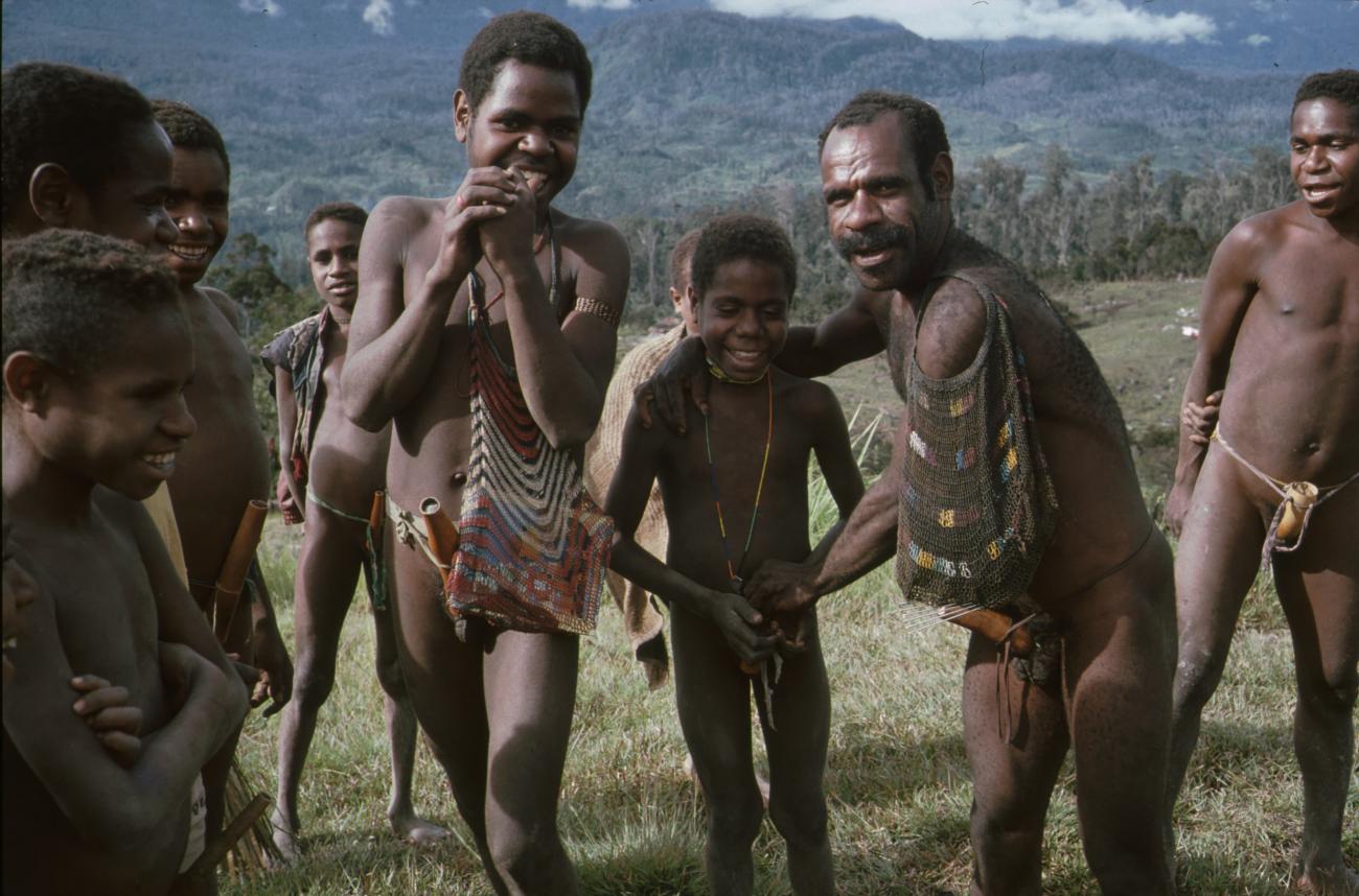 BD/166/329 - 
Group of Papua men in the open field
