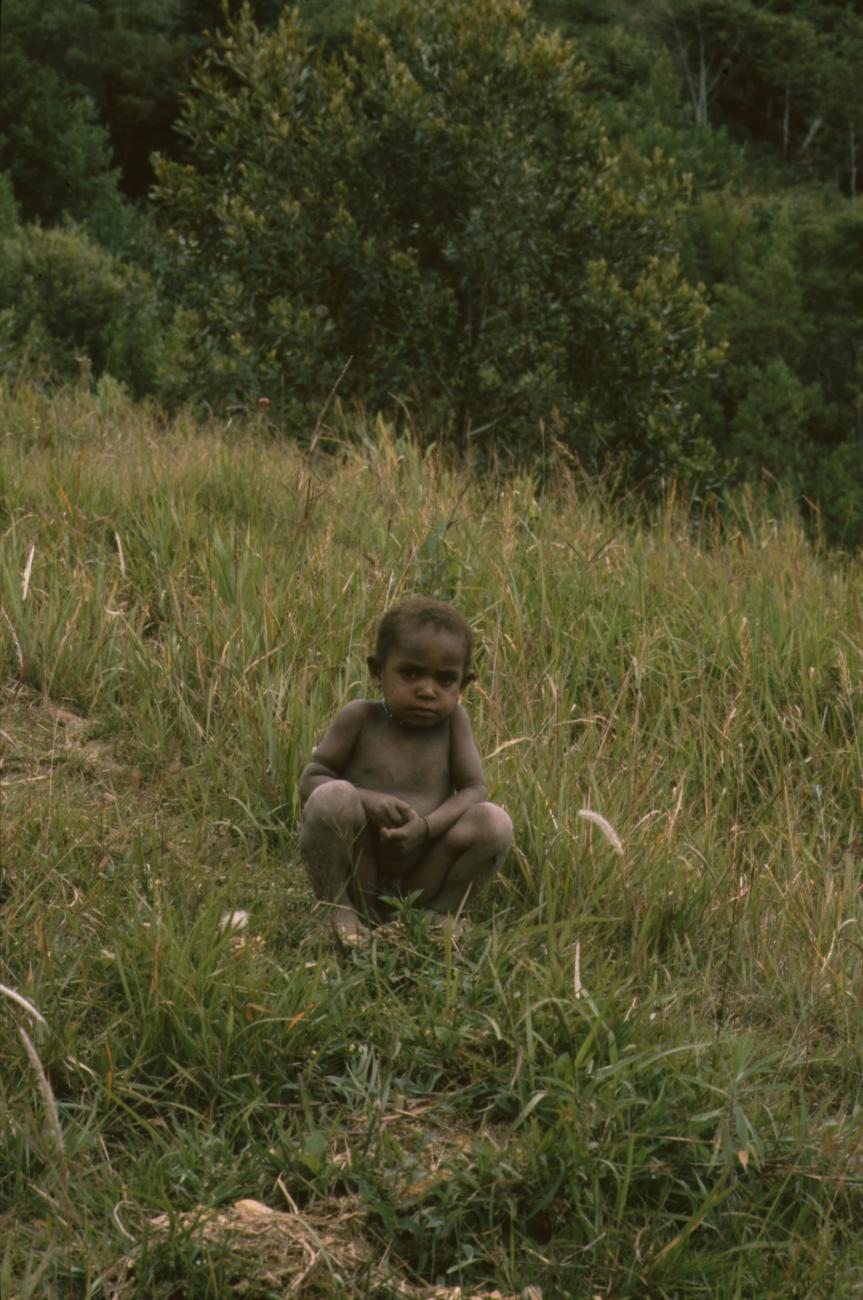BD/166/90 - 
Toddler crouching on mountainside
