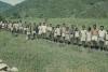 BD/248/97 Groep jeugdige Papoea's met stokken