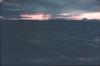 BD/171/450 Zee aan de kust bij zonsondergang