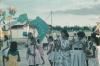 BD/171/623 Vrouwen en meisje met bord Nederlands Nieuw-Guinea