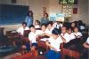 BD/269/786 Papoeameisjes in klaslokaal met cheque